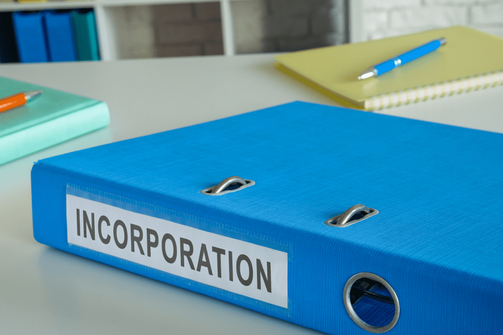 A large blue binder with INCORPORATION written across in